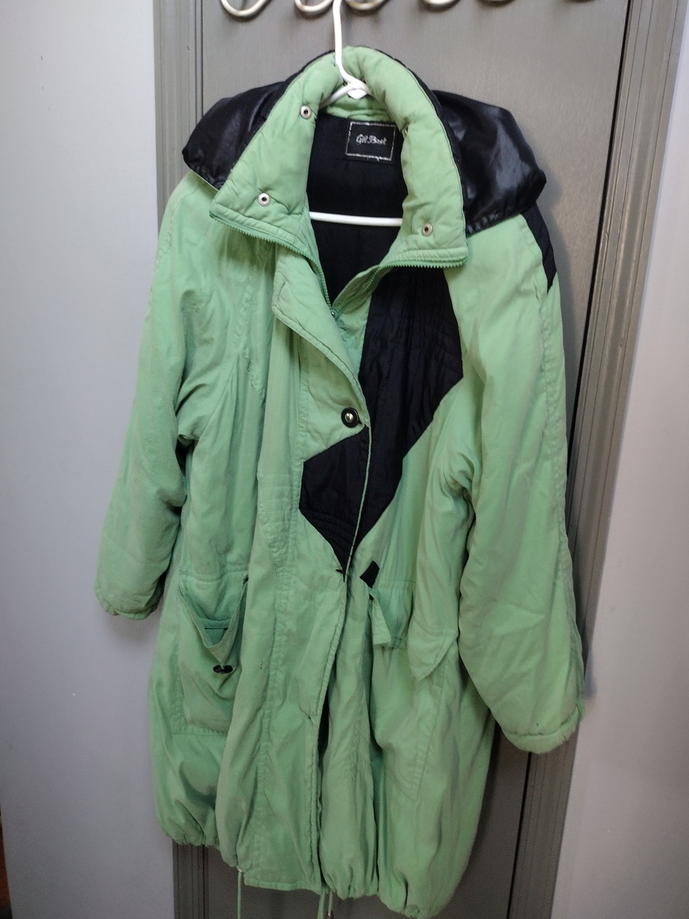 Mint Green Puffer Jacket with Black Accents